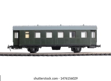 Model of a steam locomotive and cistern on rails on a white background