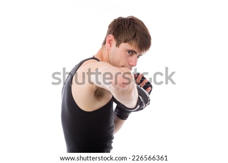 Similar – Image, Stock Photo Close up front portrait of one young middle age athletic woman in sportswear in gym over dark background, standing in boxing stance with hands and fists, looking at camera