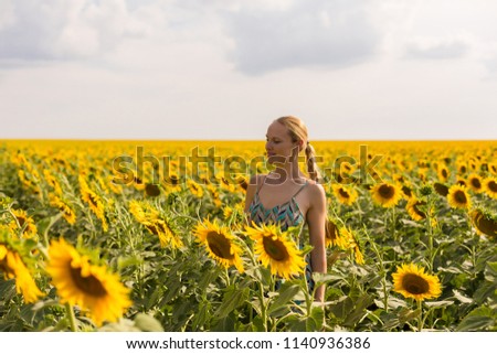 Model in sunflower field