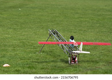 A model Unmanned Aerial Vehicle UAV on a catapult launch system used for takeoff. The plane was built from foam and wood