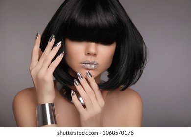 Model With Unrecognizable Face, Glitter Lips And Black Shiny Hair. Woman Bob Haircut Styling. Beauty Makeup, Silver Manicured Polish Nails. Bob Hairstyle. Fashion Style Brunette Woman Portrait