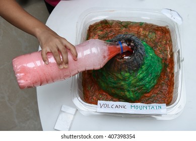 Model Of Volcano, Science Fair Project/ School Science Project, Kids Presenting Their Science Home Project At School. Volcanic Eruption Molten Lava, Prepared For Education Purpose For Kids