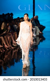 A model walks the runway for Designer Giannina Azar Fashion Show during Art, Hearts, Fashion Swim Week  at the Faena Forum in Miami Beach on 
 7- 8- 2021