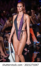 A model walks the runway for Designer Mister Triple X Fashion Show during Art, Hearts, Fashion Swim Week  at the Faena Forum in Miami Beach on 
 7- 8- 2021