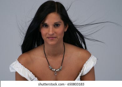 Model Wearing Peasant Blouse Grey Backdrop