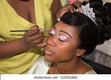 Model Young Pretty American Black Woman Getting Her Eyes Make Up Done By Professional Artist Using Brush Applying Eyeshadow For Wedding Celebration