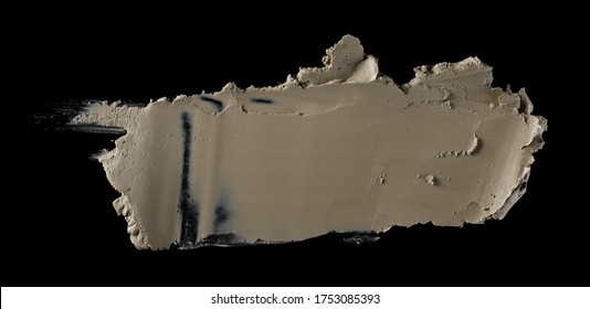 Modelling clay spread on surface isolated on black background, top view