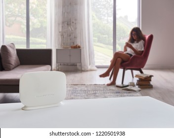 Modem Router Internet Close Up And Young Girl Using Smartphone And Connecting Internet In The Home.