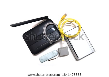 Modems and ethernet cables in a white background                               