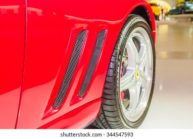 MODENA, ITALY - APRIL 2015: Museum Enzo Ferrari Modena. Red Ferrari 575 Superamerica 2005. Side View. Front Wheel.