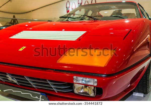 MODENA, ITALY - APRIL 2015: Museum  Enzo Ferrari\
Modena. Red Ferrari BB 512i  with The Cavallino Rampante, symbol of\
Ferrari on. Front view.