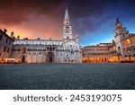 Modena, Italy. Cityscape image of Modena, Italy with Piazza Grande at dramatic spring sunset.