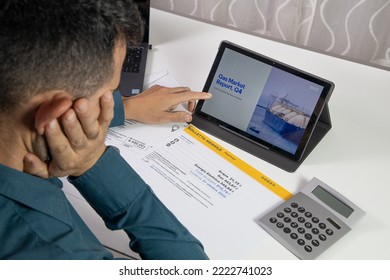 Modena Italy - October 31 2022: A Man Who Looks At The High Gas Bill To Pay