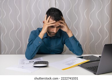 Modena Italy - October 31 2022: A Man Who Looks At The High Gas Bill To Pay