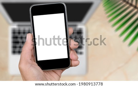 Moder mobile phone with blank screen in hand.