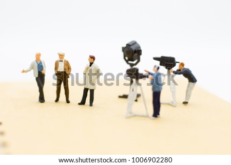 Moderator are interviewing guests with camera and video capture. Image use for Entertainment Industry.