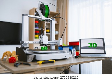 A modern 3D printer is actively creating green plastic letters on its build plate while a laptop displays the word 3D - Powered by Shutterstock - Get 15% off with code: PIKWIZARD15