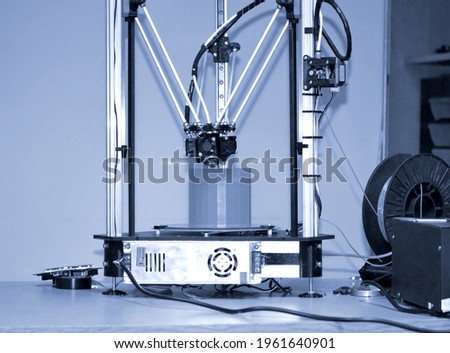 Modern 3D printer printing figure close-up. Automatic three dimensiona