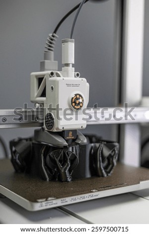 Modern 3D printer printing figure close-up