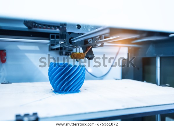 Modern 3D printer printing figure close-up macro