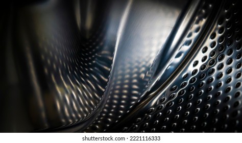 Modern abstract background with shiny metal, distorted black carbon fiber with dark dots, dents, surfaces with angles and curves, closeup view with a copy space. - Powered by Shutterstock