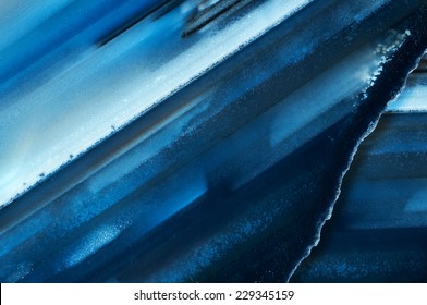 Modern abstract background of two polished slices of the gemstone called Blue Agate