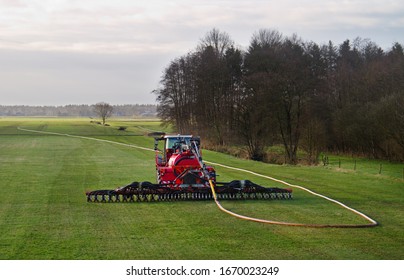 Modern agriculture: injection of liquid manure in grass land using a drag hose applicator