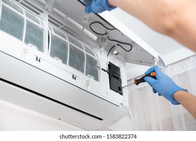 Modern air conditioner unit service. Cleaning the filter, fumigation. Air conditioner service.
