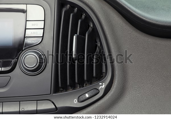 Modern air\
conditioning control panel in car,\
closeup