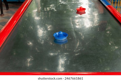 Modern air hockey attraction in the park, close-up view - Powered by Shutterstock