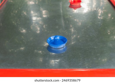 Modern air hockey attraction in the park, close-up view - Powered by Shutterstock