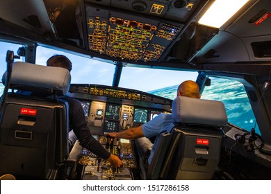 modern airbus airplane cockpit with pilots during a training session in a full flight simulator  - Shutterstock ID 1517286158