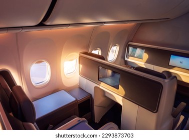 Modern airplane interiors, luxury first class and business class seats with entertainment area.