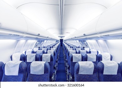 Modern Airplane seats in perspective. Transportation concept. Aircraft's corridor interior in modern tones.