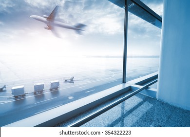 modern airport scene of passenger motion blur with window outside.