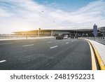 Modern Airport Terminal and Roadway at Sunrise