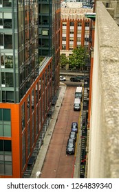 A Modern Alley Way In Downtown Seattle Washington. A Modern Building Contrasted Against The Old Vintage Ones.