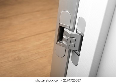 Modern aluminum door hinges on white doors, close-up. copy space, place for text