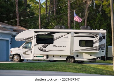 Modern Americal Motor Home Van Parked In Front Of A House. USA Travel Concept. Tampa, Florida, USA - June 3, 2022.