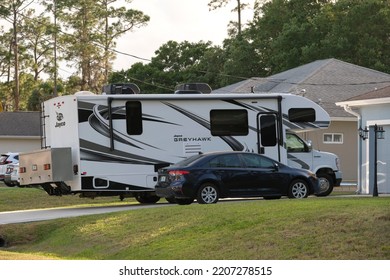 Modern Americal Motor Home Van Parked In Front Of A House. USA Travel Concept. Tampa, Florida, USA - June 3, 2022.