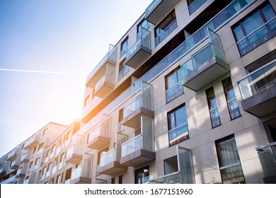 Modern Apartment Building Exterior Concept. Sunshine Sun Flare.