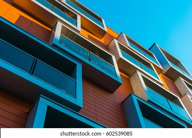 Modern Apartment Building With Red Facade