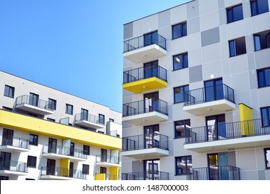 Modern apartment buildings on a sunny day with a blue sky. Facade of a modern apartment building - Shutterstock ID 1487000003