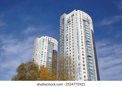 Modern apartment buildings on a sunny day with a blue sky. Facade of a modern European apartment building, Kyiv, Ukraine. Abstract architecture, fragment of modern urban geometry - Powered by Shutterstock