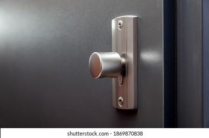 Modern apartment closed front door inside metal doorknob lock closeup, detail. House main entrance interior turn door handles knob macro, block of flats private property protection, safety concept - Shutterstock ID 1869870838