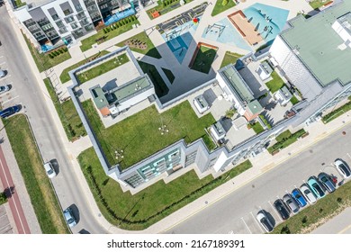 Modern Apartment House With Green Grass Floor On Flat Roof. Drone Photo From Above.