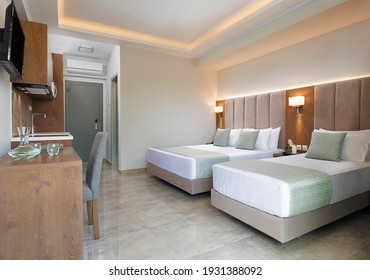 Modern Apartment Interior Of Bedroom With Oak Wood Furniture, Single, Double King Size Bed, Soft Grey Textile Headboard. Contemporary Family Studio Hotel Room  With Kitchen