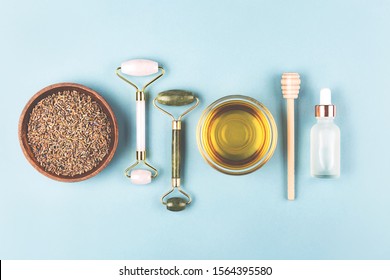 The Modern Apothecary Or Home Spa Composition. Selfcare, Relaxation And Beauty Items. Jade Rollers, Dry Lavender And Honey. Flatlay, Top View. Copy Space For Your Text.