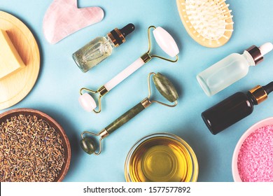 The Modern Apothecary Or Home Spa Composition. Selfcare, Relaxation And Beauty Items. Jade Rollers, Dry Lavender, Serums, Essential Oil, Honey. Flatlay, Top View. Copy Space For Your Text.