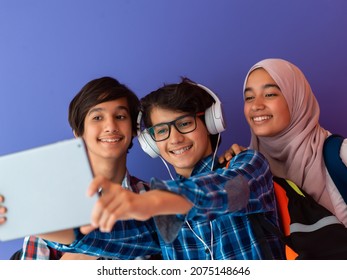 Modern arab teens use smartphone, tablet and latpop to study during online classes due to corona virus pandemic - Powered by Shutterstock